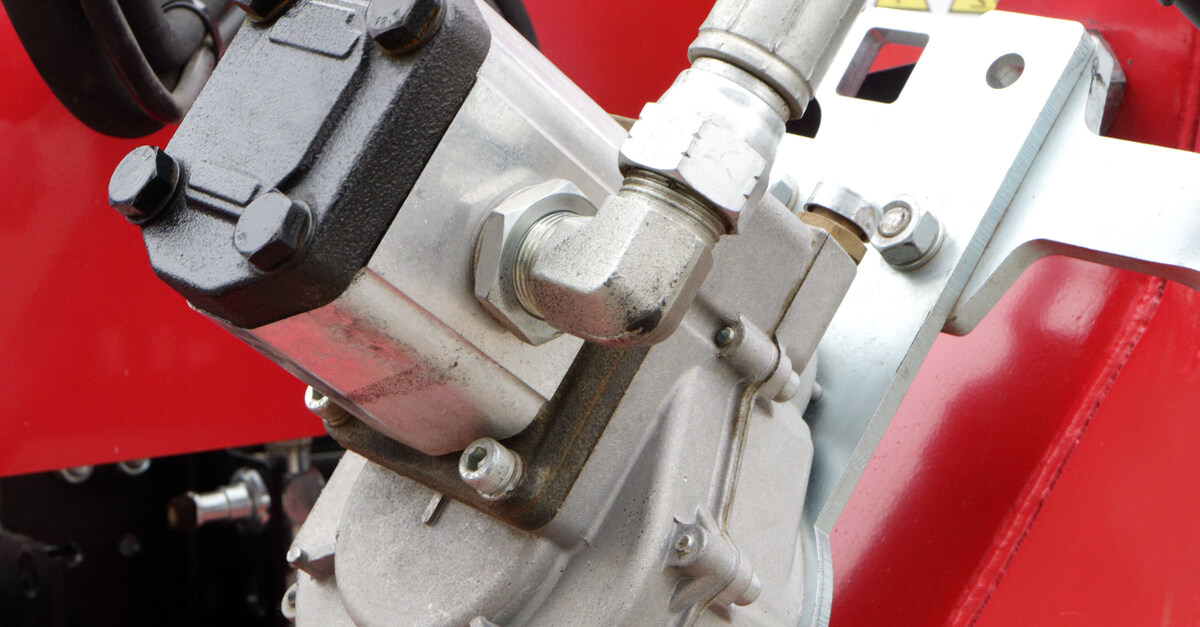 An industrial hydraulic gear motor and a gearbox that are components of a system of technical equipment.