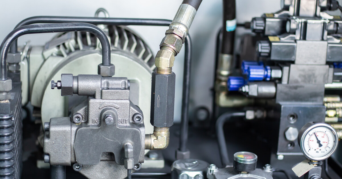 An industrial hydraulic gear motor and hydraulic pump that are components of a system of technical equipment.