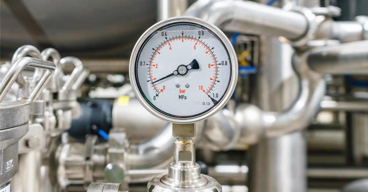 A pneumatic control system equipped with fittings, a pressure gauge, and a measuring instrument.