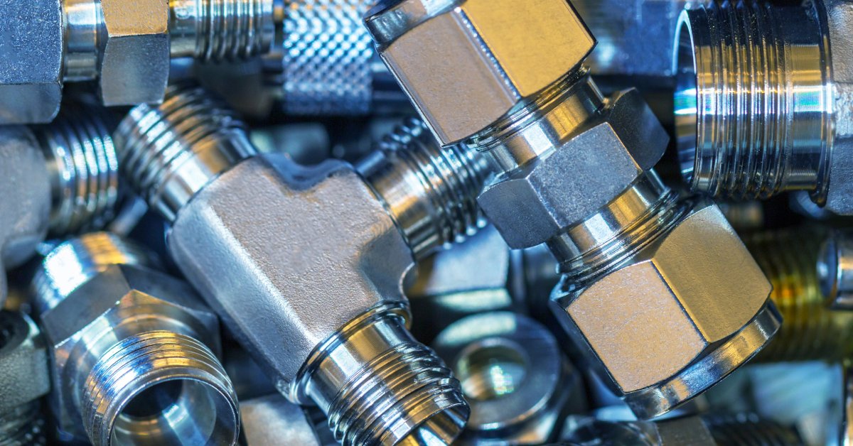A pile of several quick-connect fittings designed for easy installation to the parts of a fluid power system.