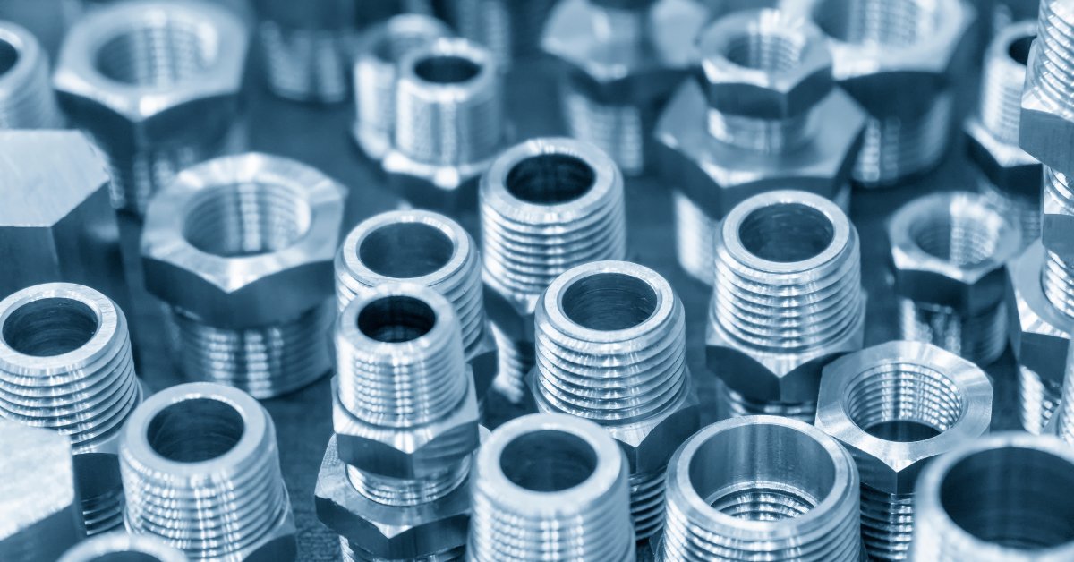 Various types of fittings for hydraulic and pneumatic systems used in industrial machinery.