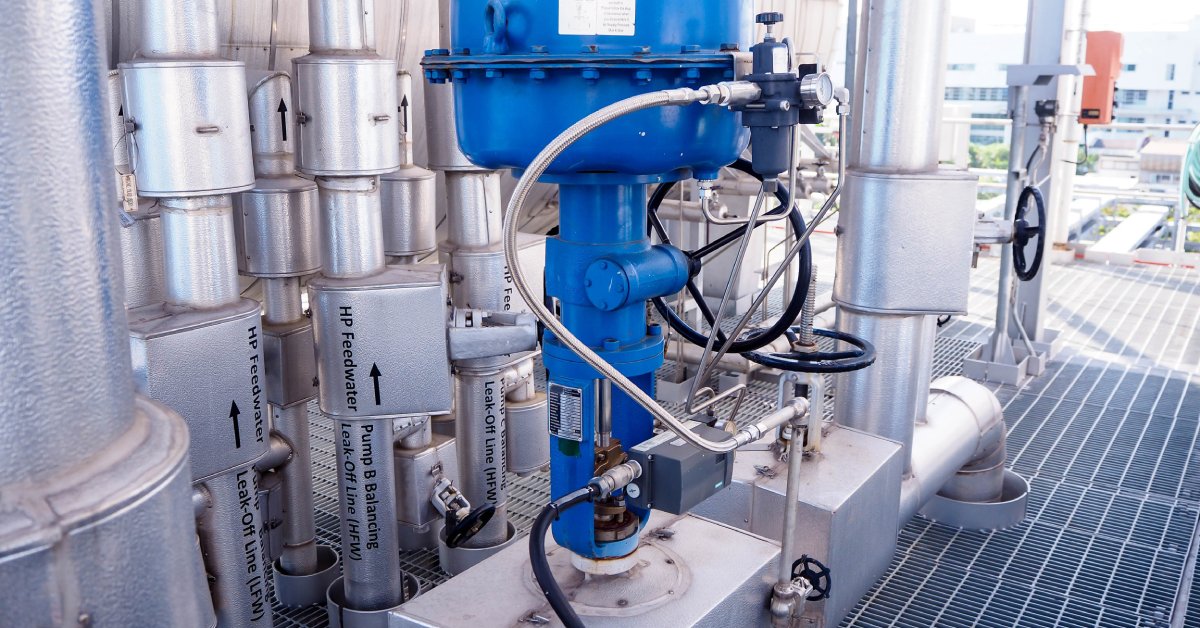 A flow control valve implemented as a component of a pneumatic system installed in an industrial setting.