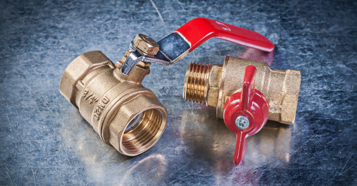 A close-up brass gate water lever ball valve for plumping or any machine operation on a black table.